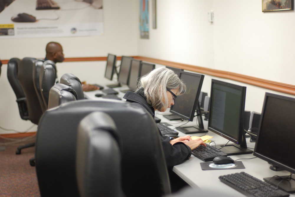 A woman working on a computer.