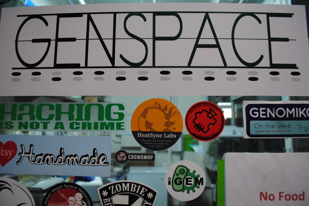 Stickers at Genspace, by Flickr user .dh