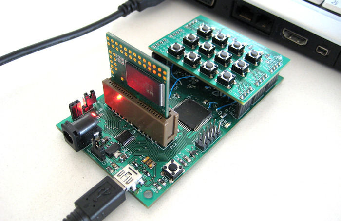 A project board in the developer housing, attached to a computer.