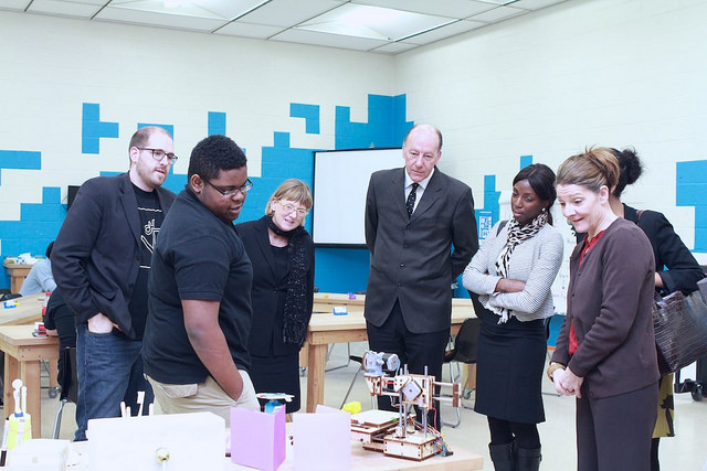 Darius McCoy (left) shows off his 3D Printer to U.S. Department of Education officials in 2015. (photo courtesy Digital Harbor Foundation)