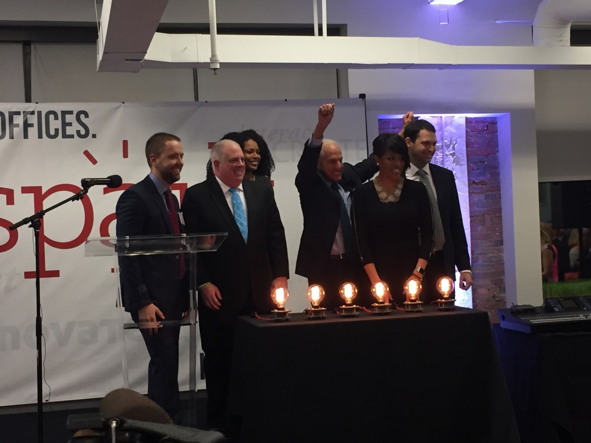 Cordish Companies CEO David Cordish (third from right) raises his arms after flicking the switch to "activate" Spark, January 2016.
