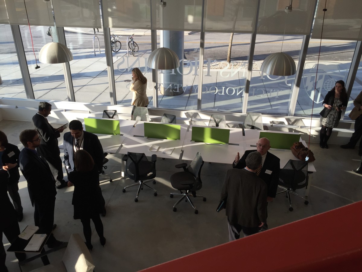 Hopkins officials mingle at the opening of FastForward East, February 2015.