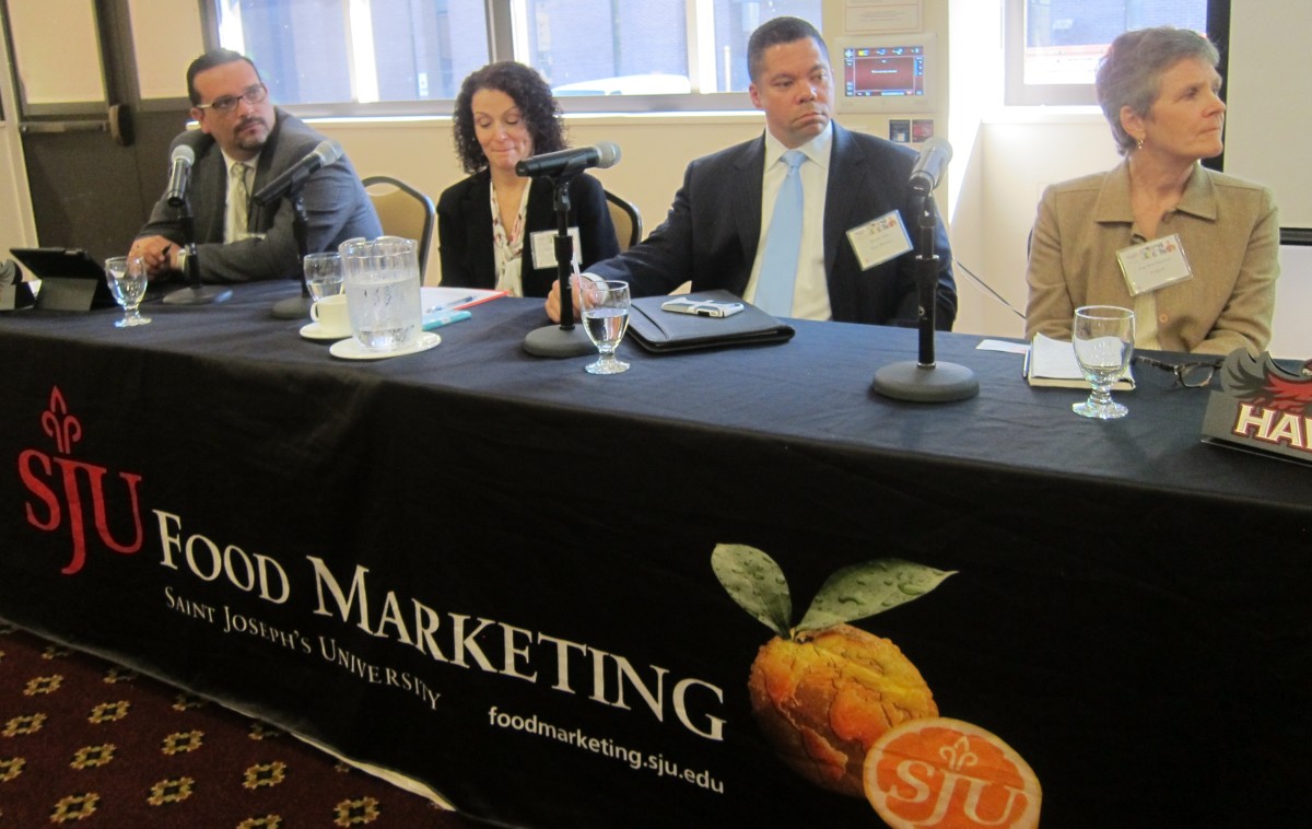 Panelists, left to right: Scott Iovine, Donna Zambo, Brian Holt and Peg Merzbacher listen to moderator and St. Joe's Marketing Professor George Latella.