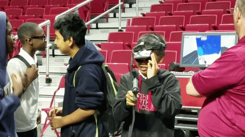 A student practices virtual spray painting at the Philadelphia School District's first STEM expo.