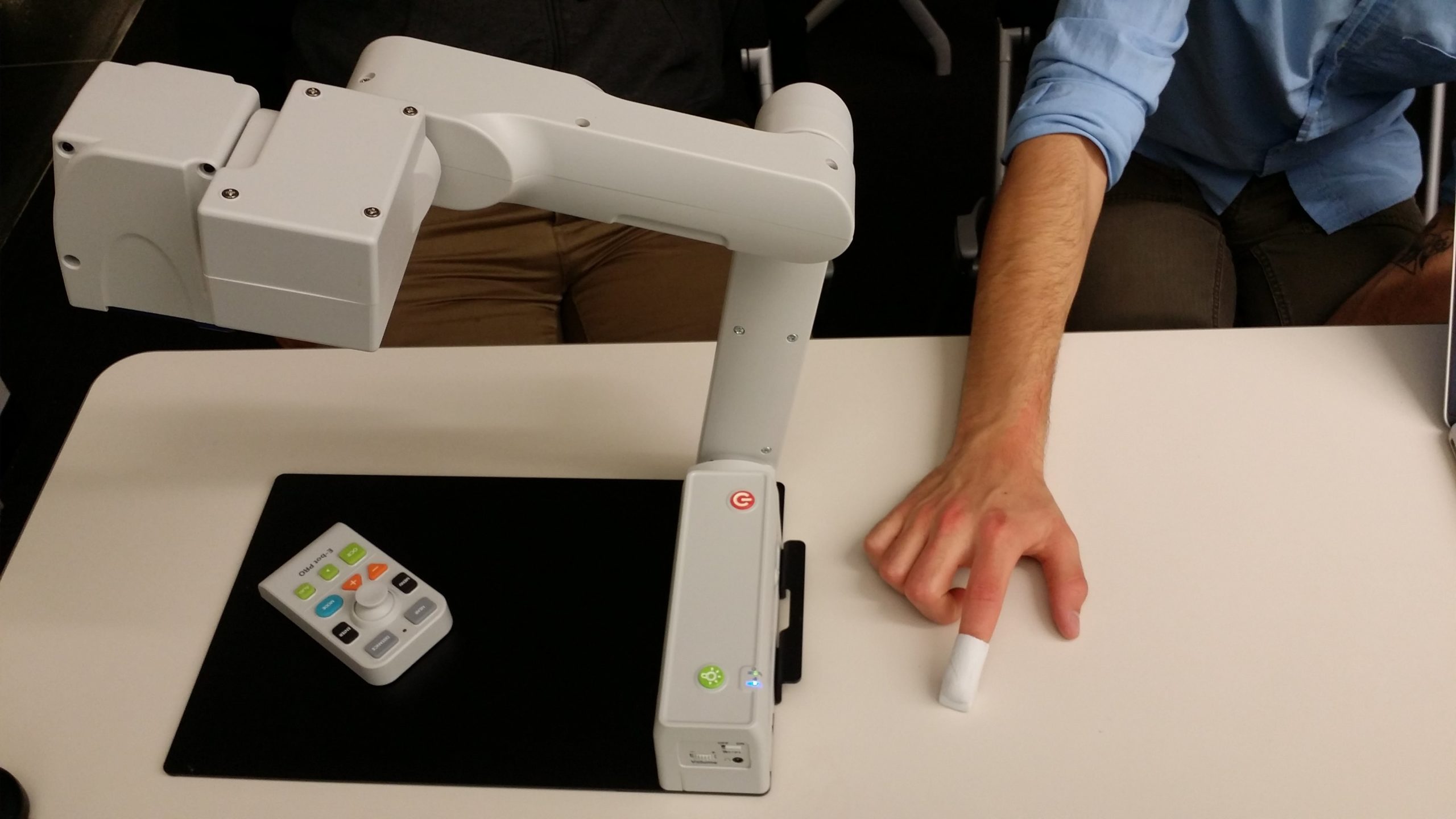 A side-by-side comparison of the E-bot PRO (left) and a prototype of the Touch Reader, which would both serve the same purpose.