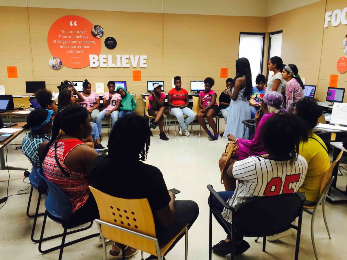 Young girls gathered in a computer lab in this Soutwest affordable housing facility to learn the basics of HTML