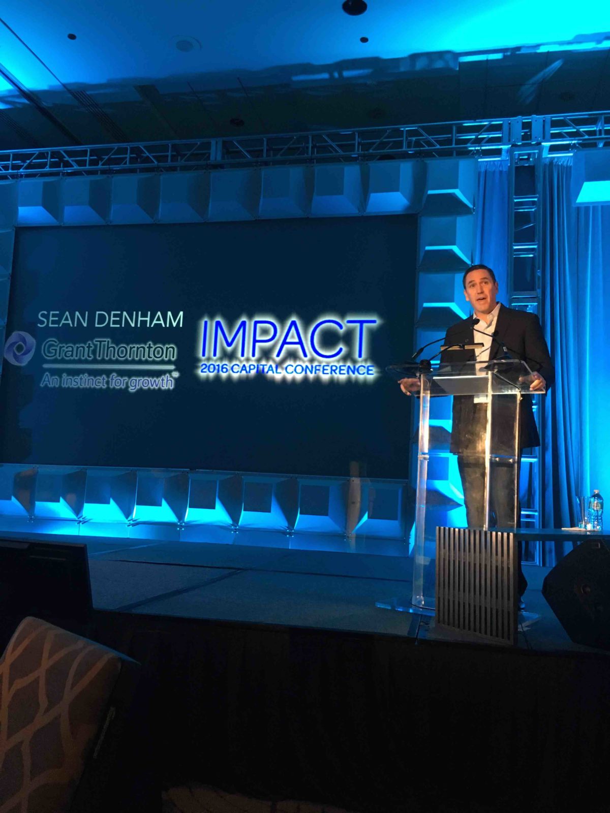 Sean Denham welcomes the crowd at IMPACT 2016.