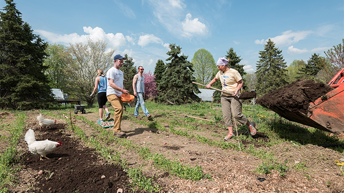 McKay Jenkins and his environmental journalism students volunteer at a local non-GMO farm near UD's campus.
