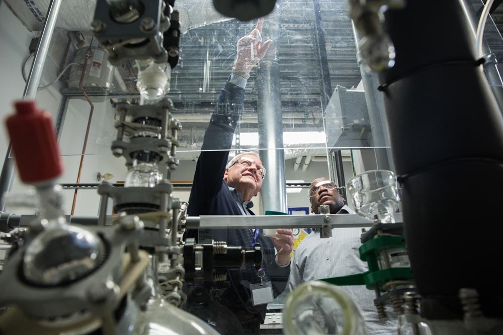 Bob Weis with a student in one of the school's hands-on learning labs.