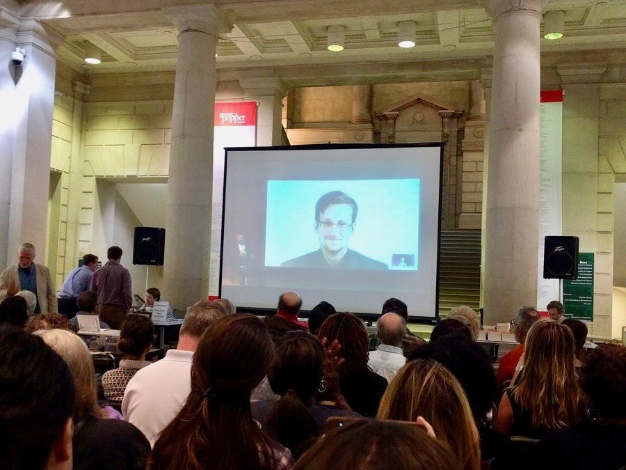 Edward Snowden appears before a crowd at the Free Library of Philadelphia, Sept. 11, 2017.