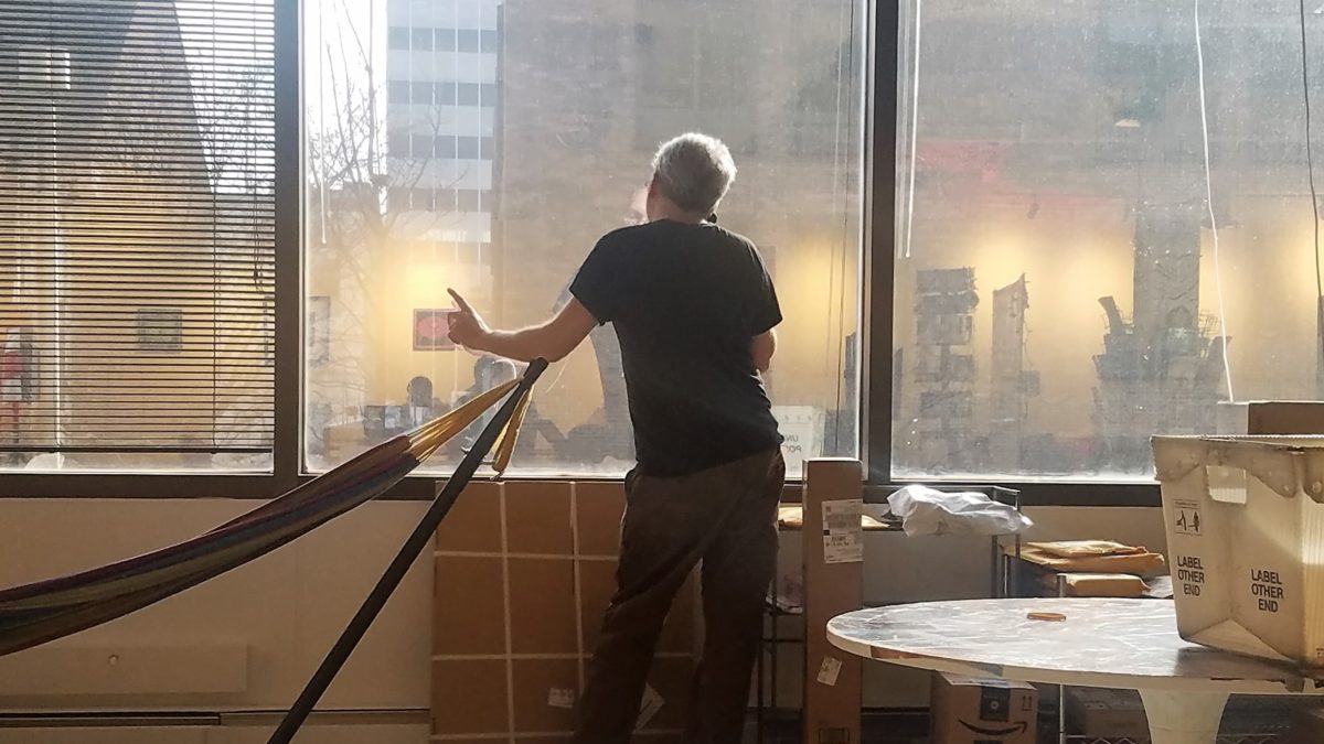 Mark Steckel, cofounder of PhillyWisper, takes a customer service call at Indy Hall.