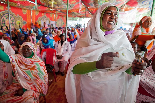 A woman enjoys the music played at a celebration organized by UNAMID to commemorate International Women's Day 2013 in North Darfur.