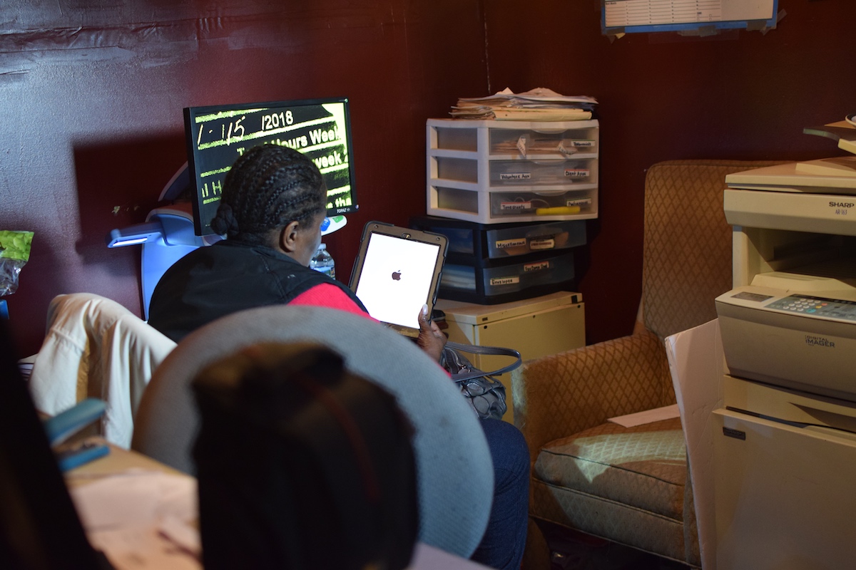 Yvonne Hughes using an iPad.