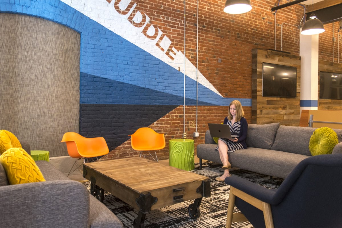 A woman sitting in an office space