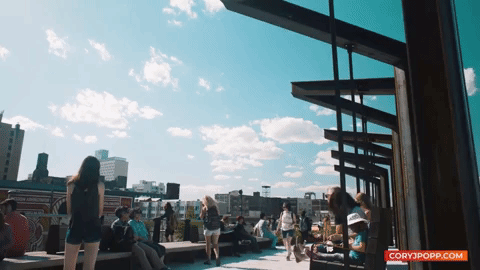 People walking across Rail Park.