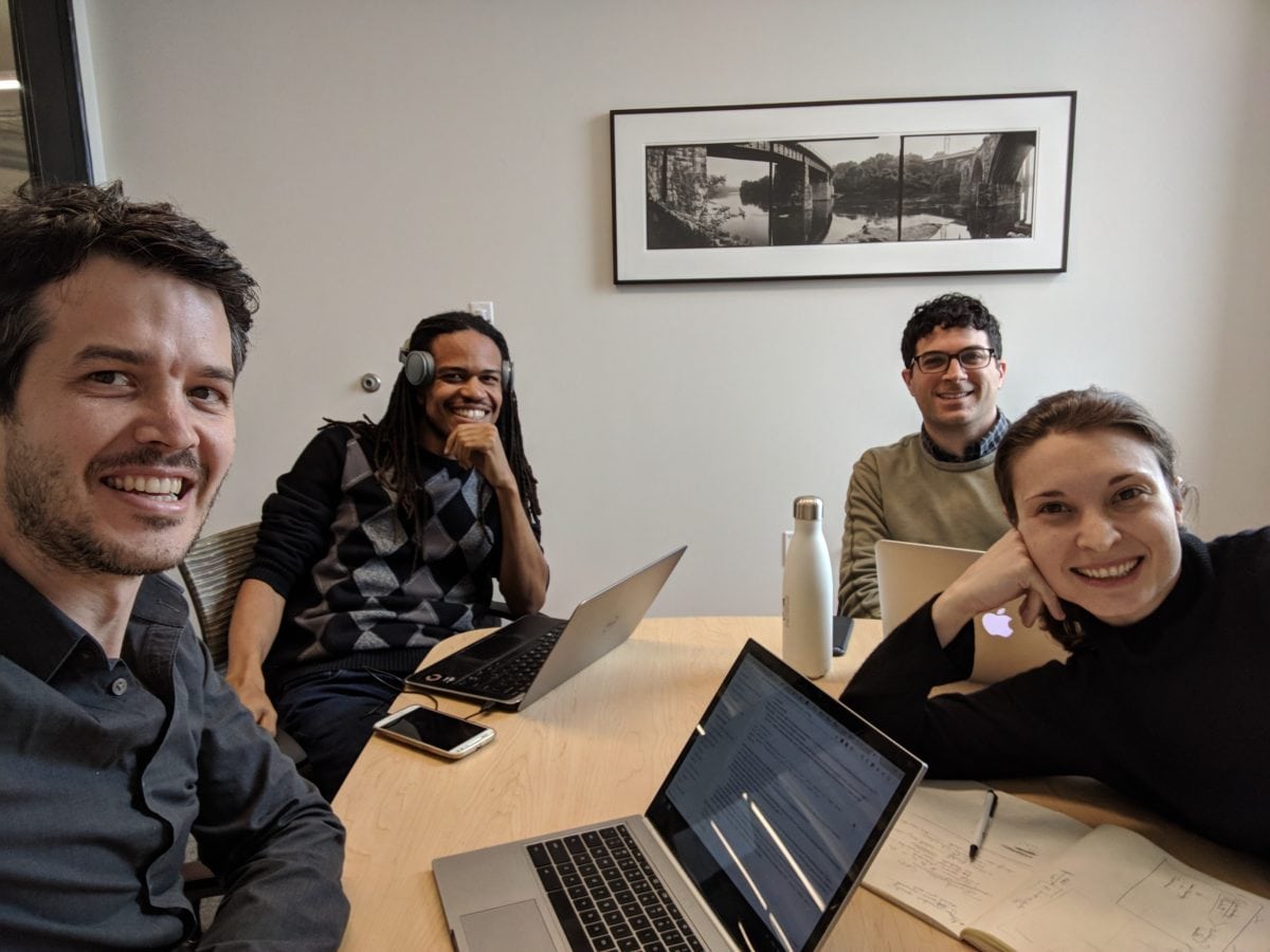 Four employees in an office.