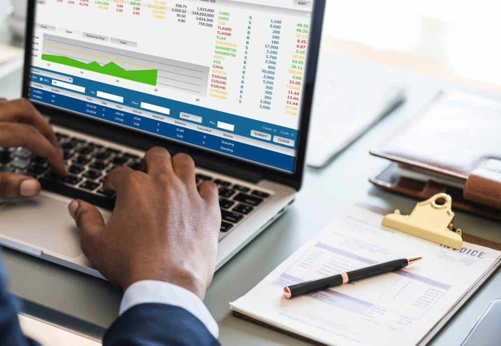 An accountant types data into a spreadsheet.