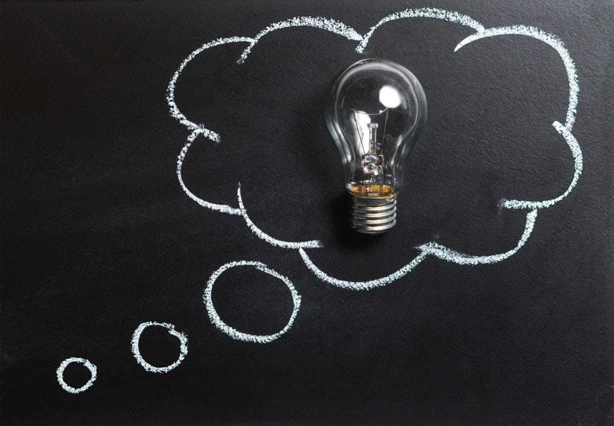 A thought bubble with a light bulb inside.