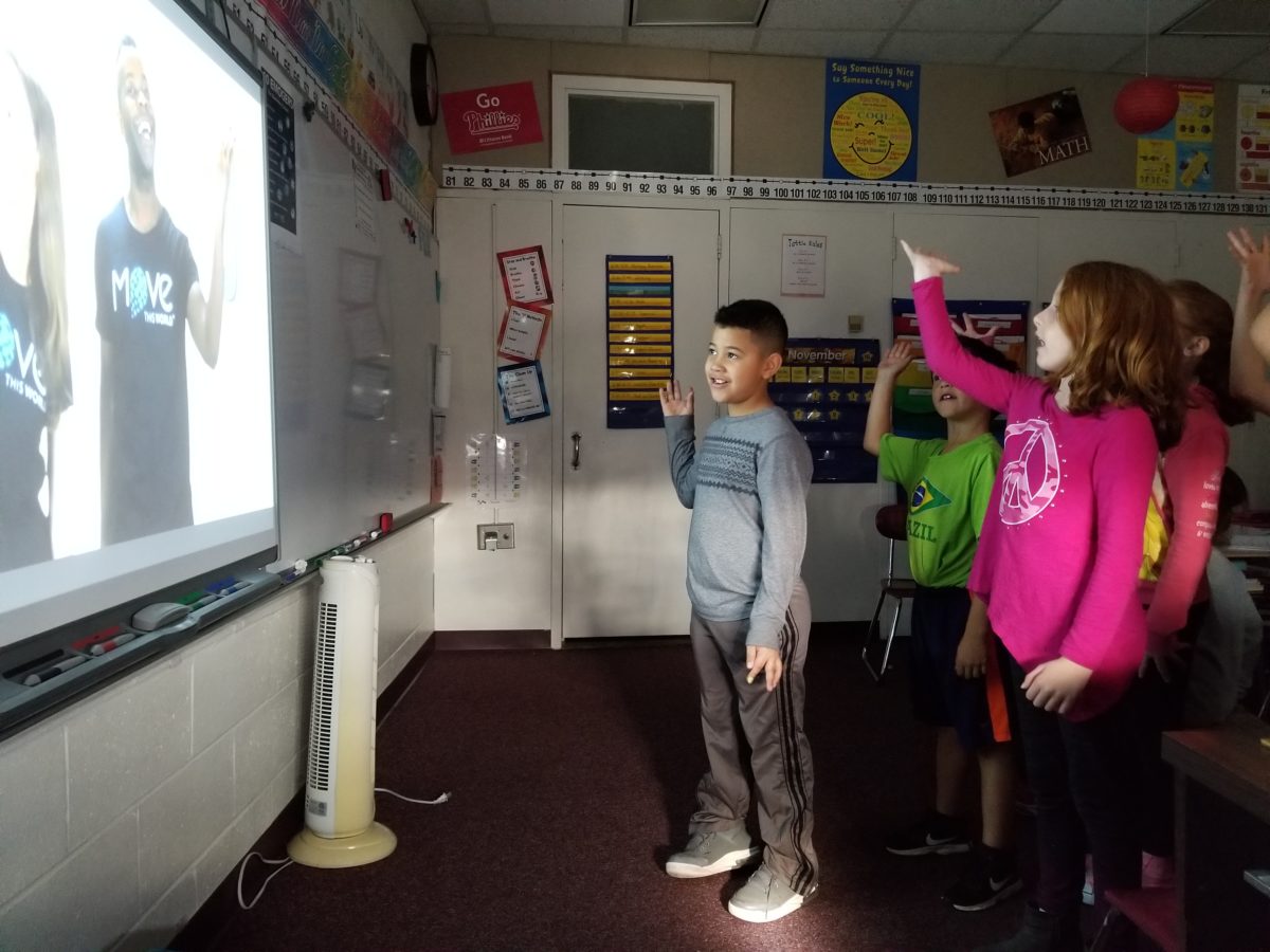 Students participate in a Move This World exercise.