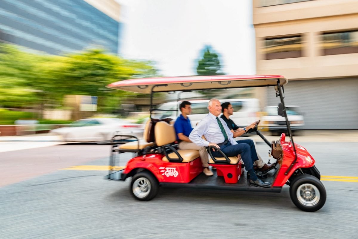 Mayor Mike Purzycki takes a ride on the WilminGo taxi.