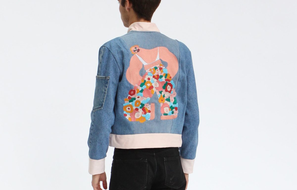 denim jacket with colorful design on the back
