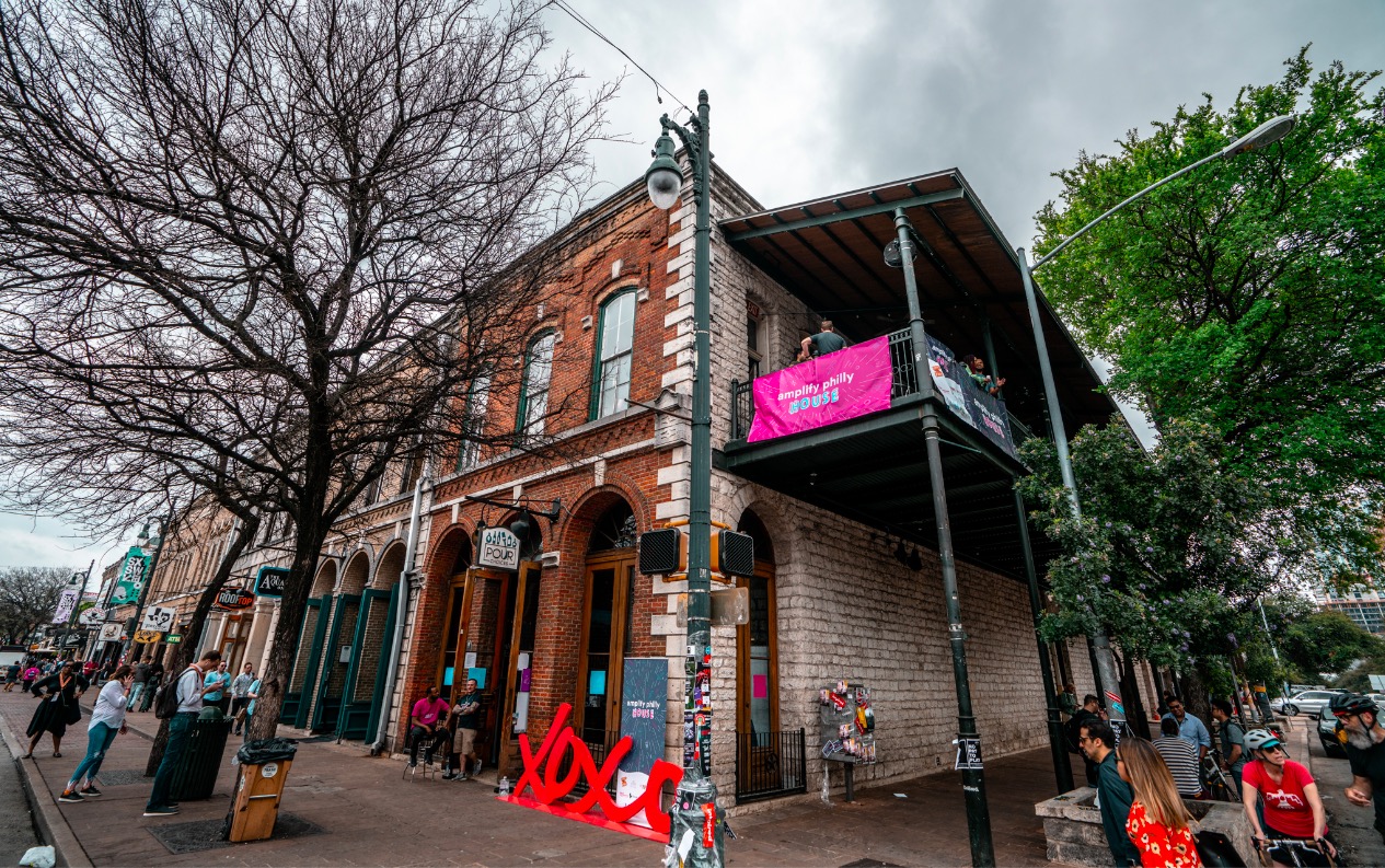 Photo of the outside of a two-story brick venue on Sixth Street