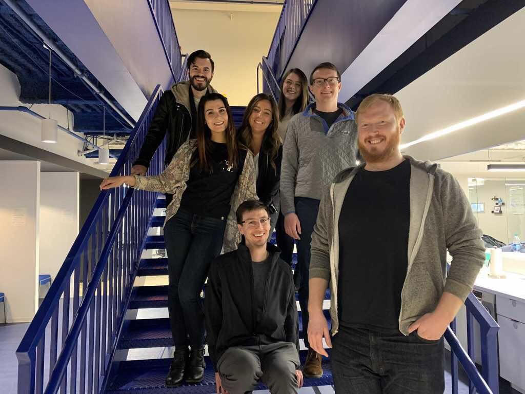 a group of staffers smiling