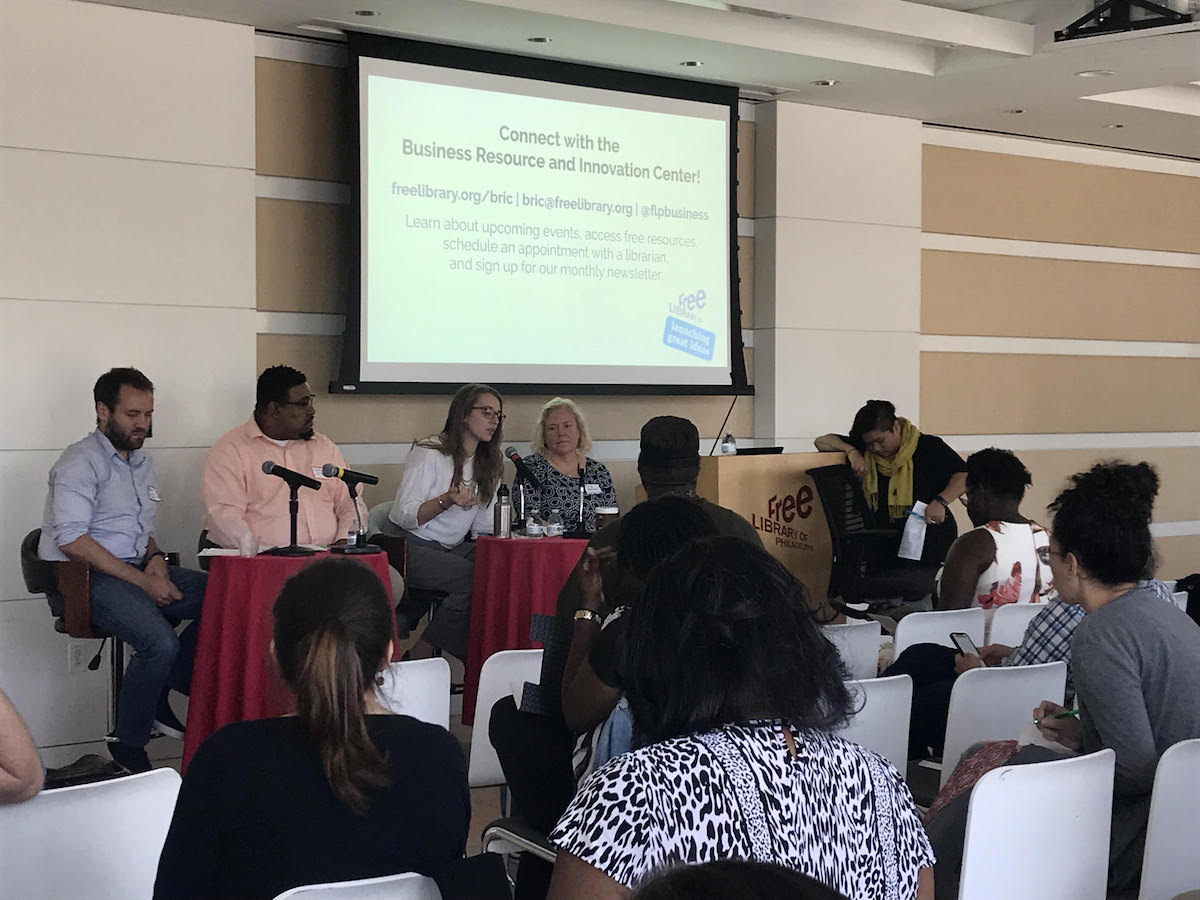 Panelists at a table