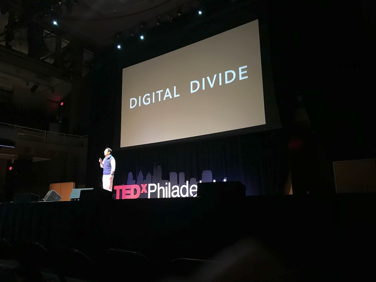 A man speaks onstage