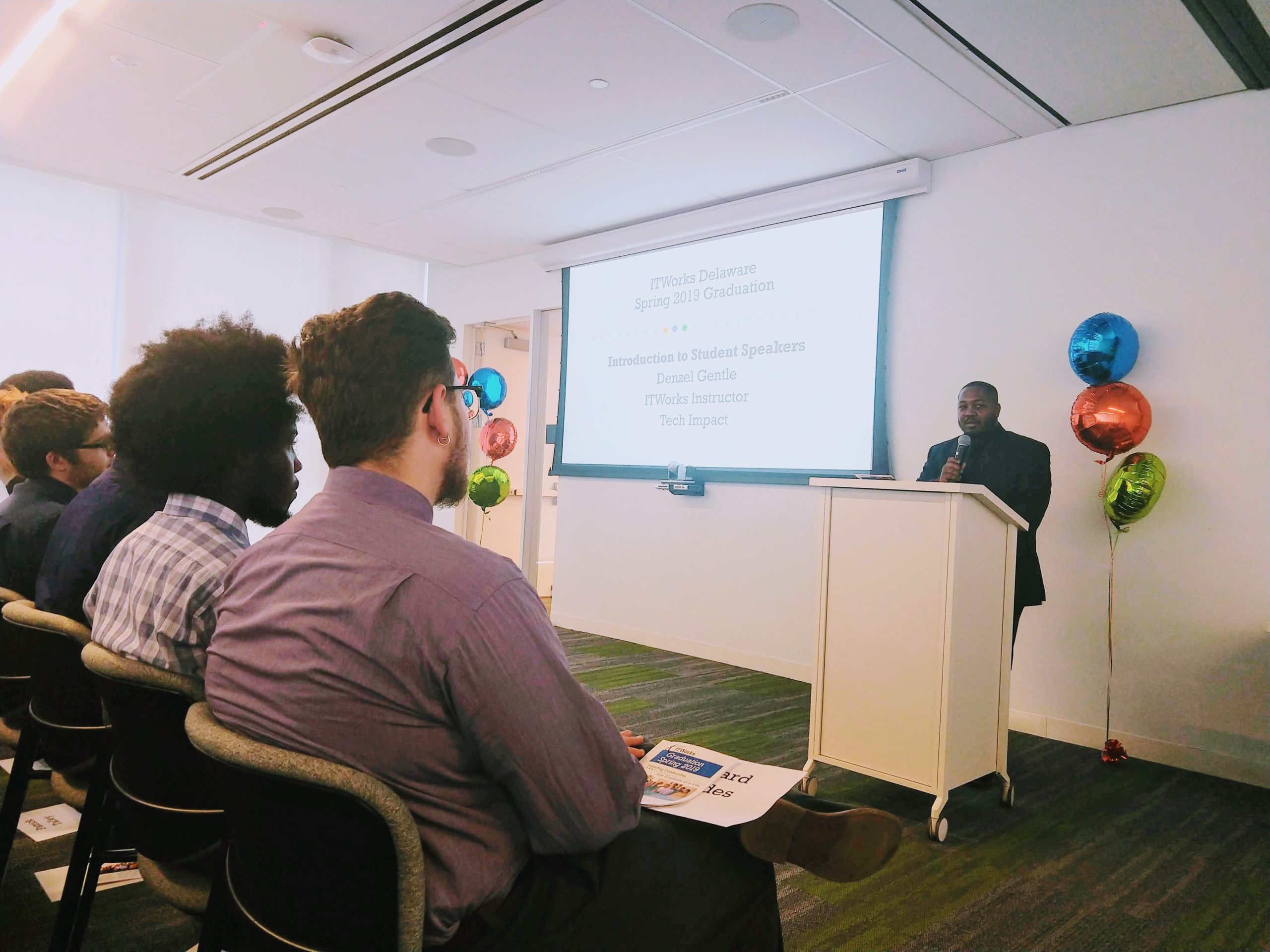 Instructor Denzel Gentle speaks at ITWorks Spring 2019 graduation