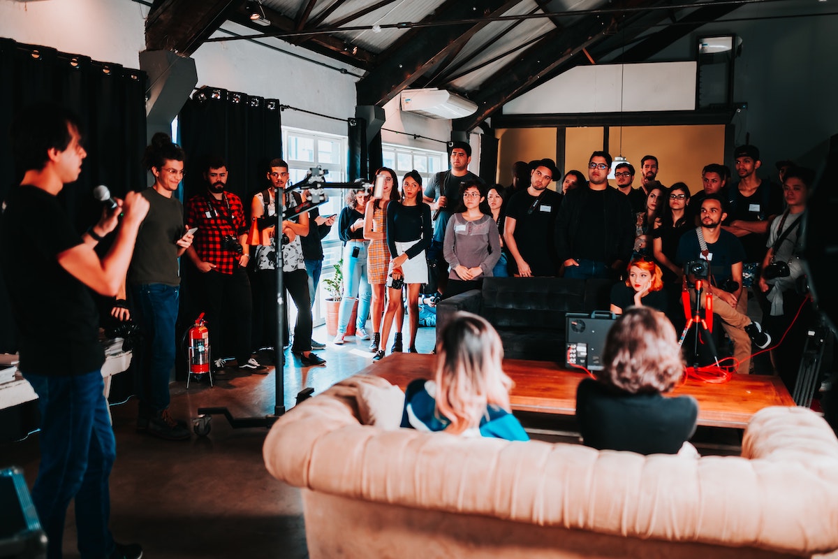 A group of people standing in a room