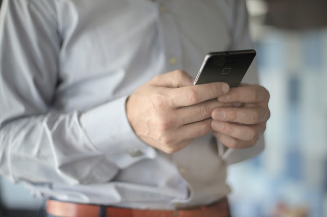 Hands holding a phone