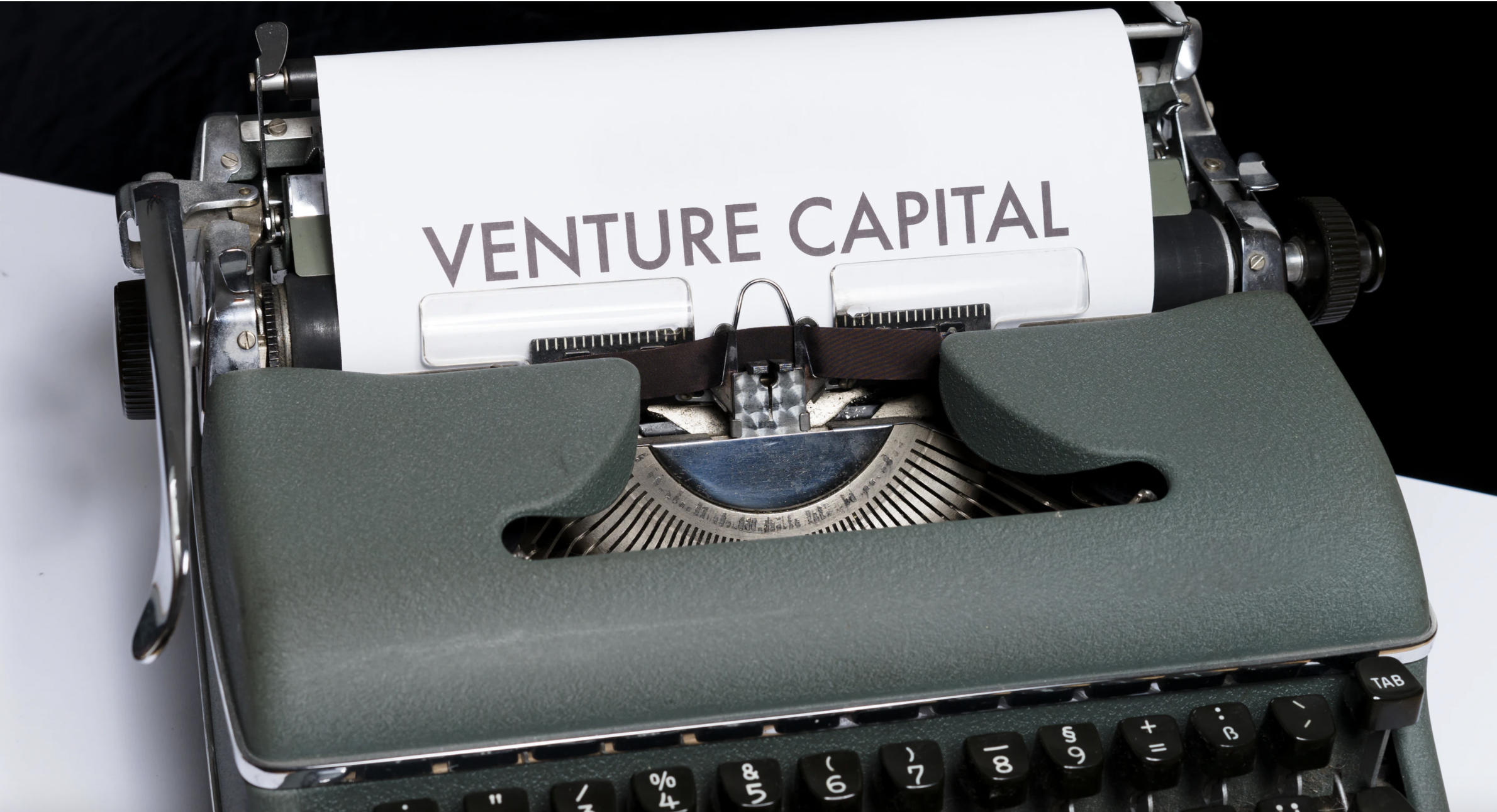 this is a typewriter with the words "Venture Capital" typed out on a sheet of paper