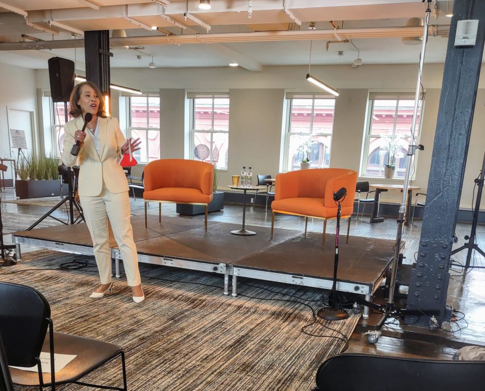 Lisa Blunt Rochester with a microphone