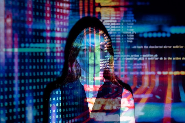 Woman with code projected on her face