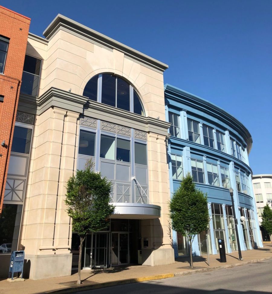 The tall front entrance of a Pittsburgh office building.