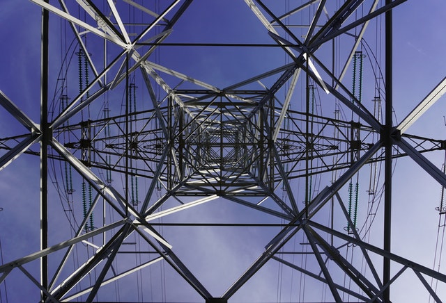 The underside of a transmission tower.