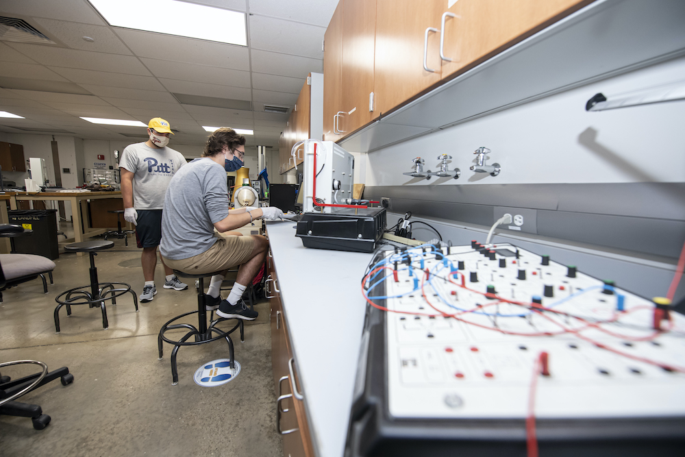 A group of people working in a lab.