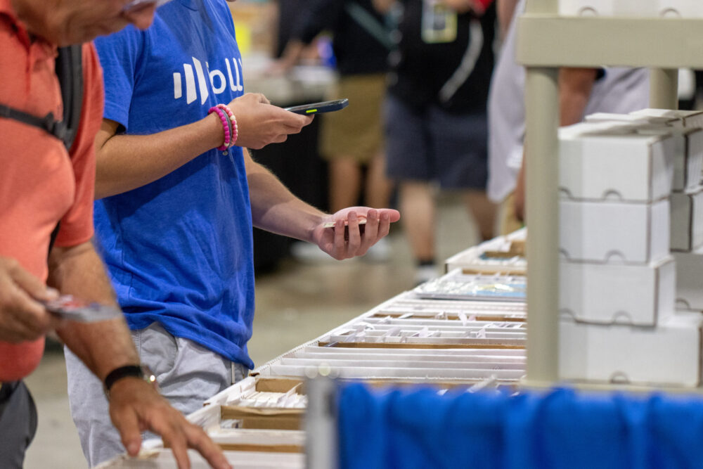 A person scanning a card with their phone.