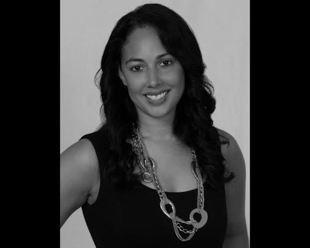 Black-and-white photo of BJ Wiley in black tank top with jewelery