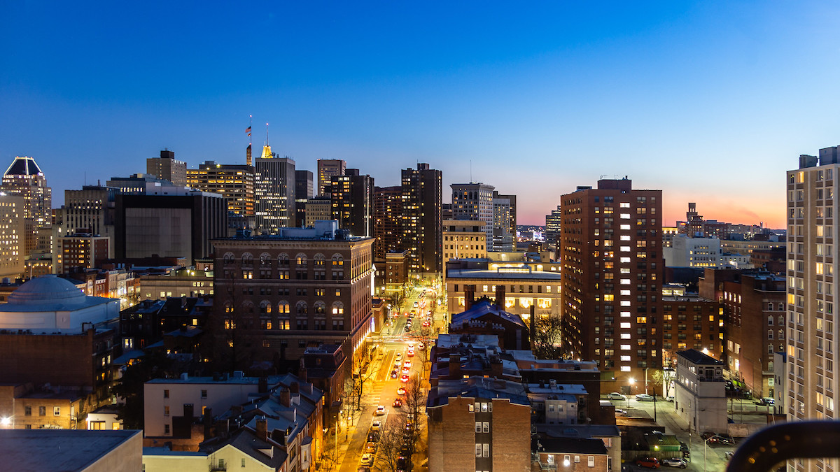 A city skyline at dusk.