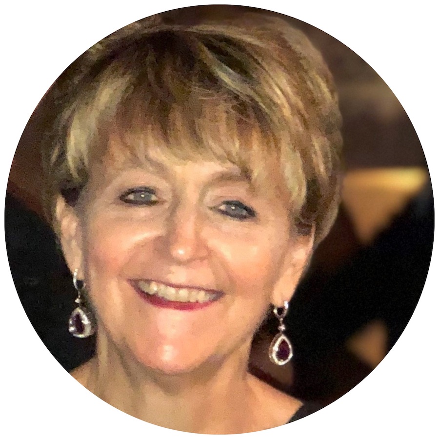 An image of a woman smiling in a circle.