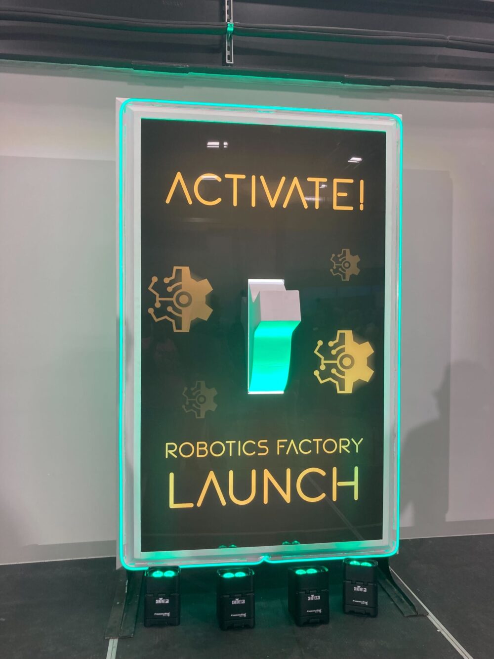 A sign with the words activefi robotics factory launch.