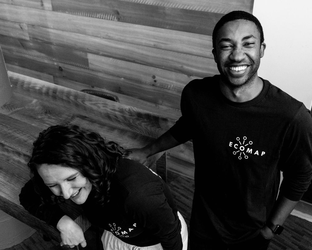 A black and white photo of a man and woman smiling.