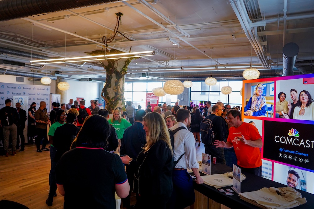 A large crowd at a tech job fair.