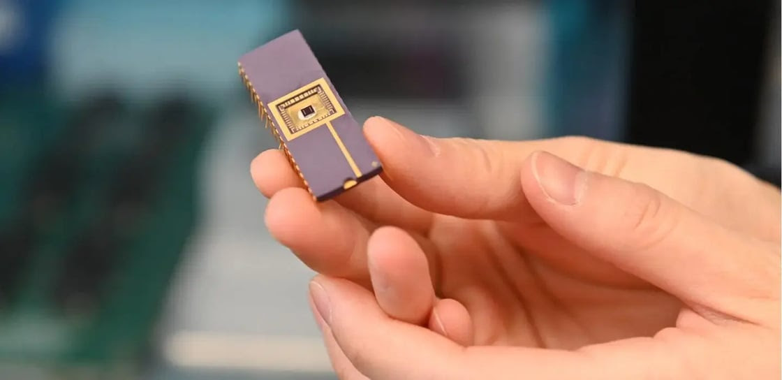 Hand holds small piece of technology