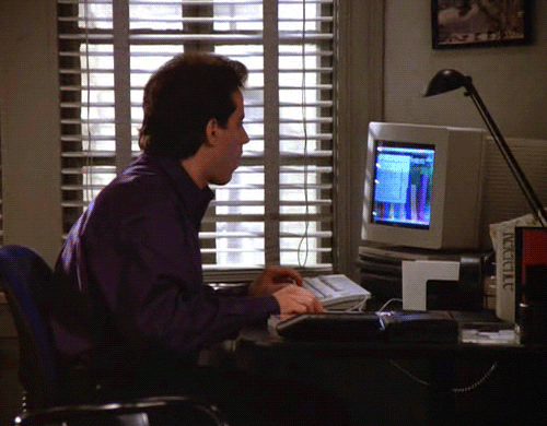 Animated gif from Seinfeld of Jerry sitting at the computer.