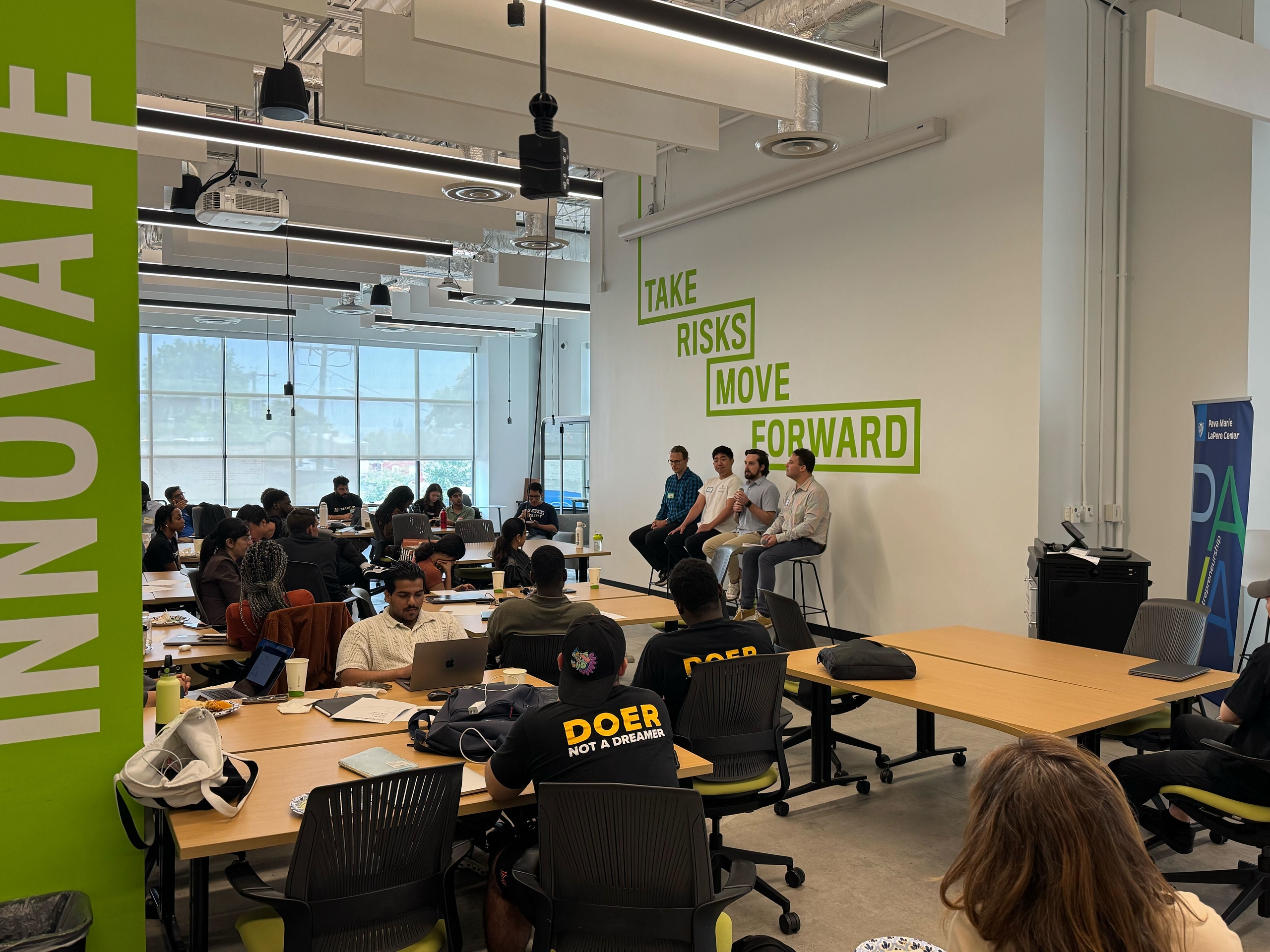 Four men presenting at the Pava Center's summer incubator.