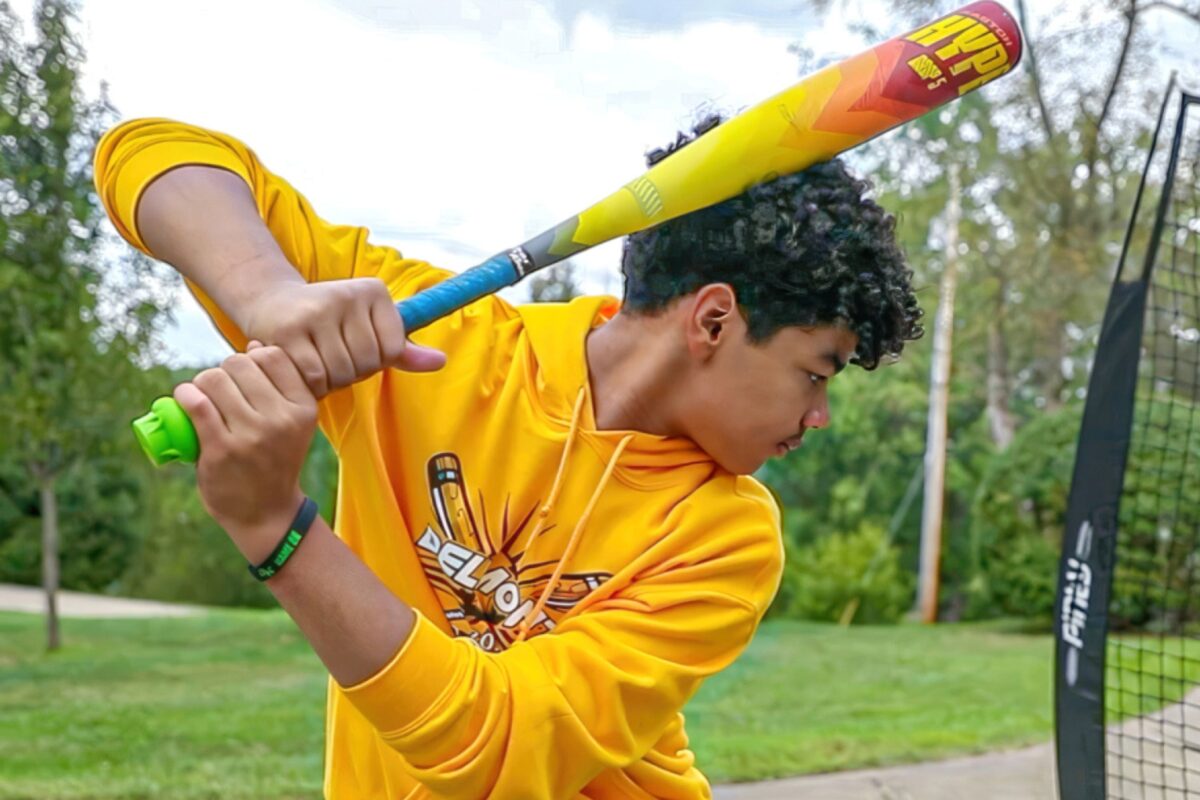 A boy holding a baseball bat.