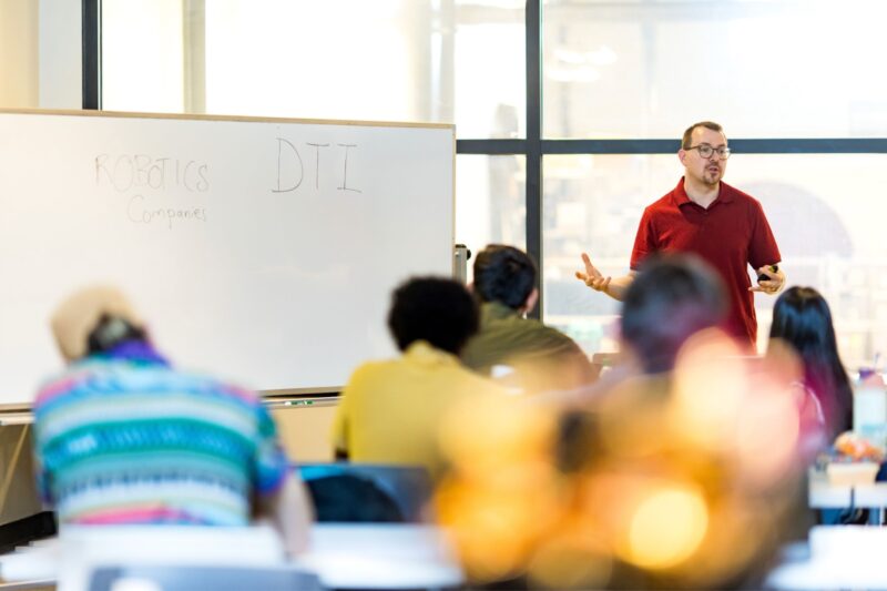 Jason Okerman stands in front of a whiteboard teaching a class (Pittsburgh Robotics Network)
